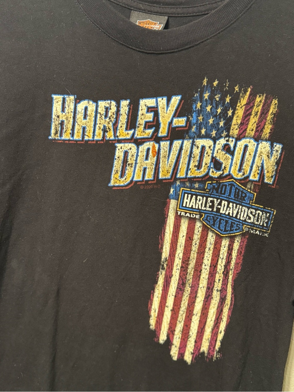 Harley-Davidson Black Tee with Distressed Yellow & Red American Flag Graphic
